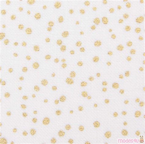 white fabric with gold dots